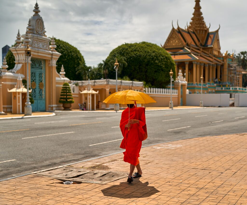 Buddhist monk in front of the Royal Palace in Phnom Penh, Cambodia