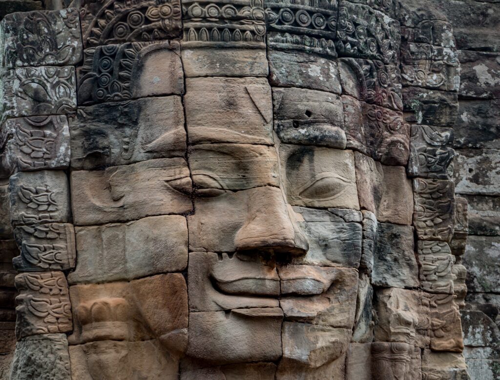 Buddha face in Bayon temple by Ray Harrington
